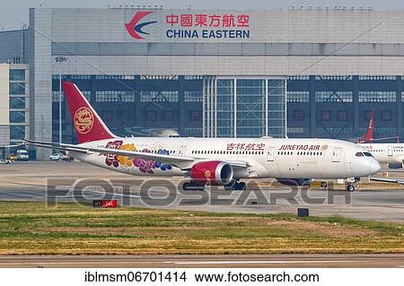 A Boeing 787-9 Dreamliner aircraft operated by Juneyao Air with registration number B-209R at Shanghai Airport, China, Asia View Large Photo Image Picture - A Boeing 787-9 Dreamliner aircraft operated by Juneyao Air with registration number B-209R at Shanghai Airport, China, Asia. Fotosearch
