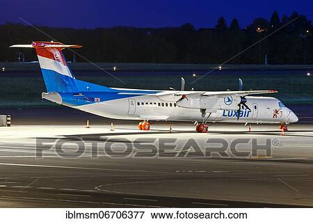 Stock Photo - A Bombardier DHC-8-400 of Luxair with the registration LX-LQB at Luxembourg Airport. Fotosearch