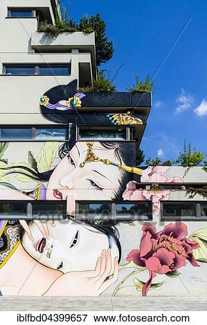 Stock Photo - A colorful graffity with japanese motive is painted at a house wall, Würzburg, Bavaria, Germany, Europe. Fotosearch