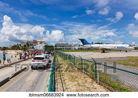 A Fokker 70 of Insel Air with the registration P4-FKC at the airport of St. Maarten View Large Photo Image Picture - A Fokker 70 of Insel Air with the registration P4-FKC at the airport of St. Maarten. Fotosearch