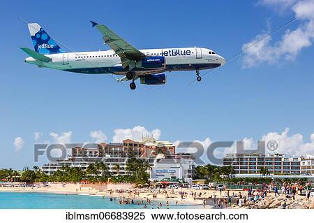 A JetBlue Airways Airbus A320 with the registration N570JB lands at the airport of St. Maarten View Large Photo Image Stock Photography - A JetBlue Airways Airbus A320 with the registration N570JB lands at the airport of St. Maarten. Fotosearch