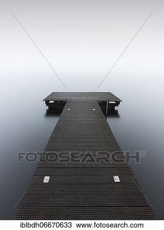 Stock Image - A jetty in dense fog in the Kleiner Schwielochsee, Goyatz, Brandenburg, Germany, Europe. Fotosearch