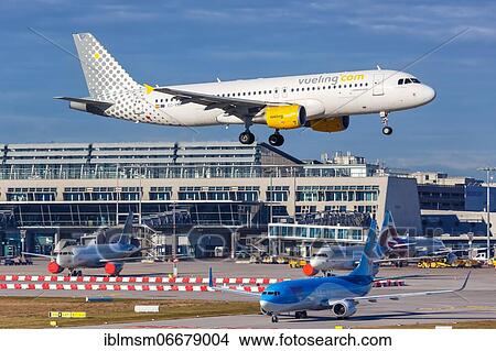 Picture - A Vueling Airbus A320 with registration number EC-KDG at Stuttgart Airport (STR), Stuttgart, Germany, Europe. Fotosearch