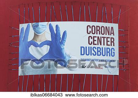 Stock Image - Advertising banner Corona Center Duisburg, Corona vaccination center, Theater am Marientor, Ruhr area, North Rhine-Westphalia, Germany, Europe. Fotosearch