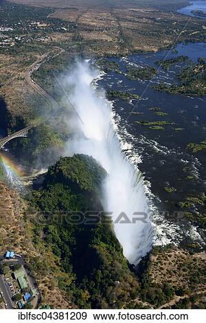 Aerial View, Zambezi river flows into the Victoria Falls, waterfall, border of Zambia and Zimbabwe, Africa View Large Photo Image Stock Photo - Aerial View, Zambezi river flows into the Victoria Falls, waterfall, border of Zambia and Zimbabwe, Africa. Fotosearch