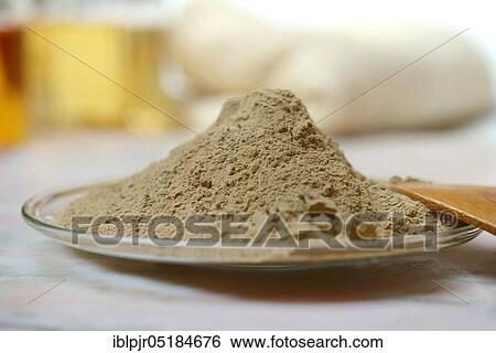 Stock Photograph - Alumina, healing earth powder on glass plate. Fotosearch