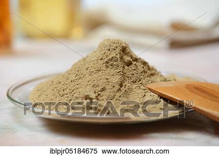 Stock Photography - Alumina, healing earth powder on glass plate. Fotosearch