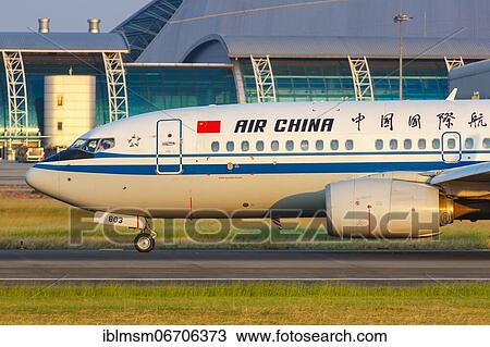 Stock Image - An Air China Boeing 737-700 aircraft with registration number B-5803 at Guangzhou Airport, China, Asia. Fotosearch