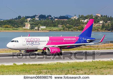 An Airbus A320 aircraft of Wizzair with registration number HA-LWR at Corfu Airport, Greece, Europe View Large Photo Image Stock Photograph - An Airbus A320 aircraft of Wizzair with registration number HA-LWR at Corfu Airport, Greece, Europe. Fotosearch