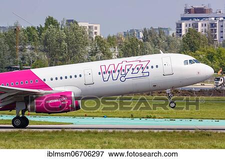 An Airbus A321 aircraft of Wizzair with registration number HA-LXV at Warsaw Airport, Poland, Europe View Large Photo Image Stock Photo - An Airbus A321 aircraft of Wizzair with registration number HA-LXV at Warsaw Airport, Poland, Europe. Fotosearch