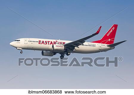 Stock Photo - An Eastar Jet Boeing 737-800 with registration number HL8269 lands at Seoul Incheon International Airport (ICN) in South Korea. Fotosearch