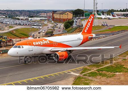 Stock Image - An EasyJet Airbus A319 with the registration G-EZAX at London Airport, United Kingdom, Europe. Fotosearch