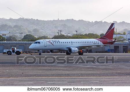An Embraer 190 aircraft of TACA with registration N935TA at Cartagena airport, Colombia, South America View Large Photo Image Stock Photography - An Embraer 190 aircraft of TACA with registration N935TA at Cartagena airport, Colombia, South America. Fotosearch