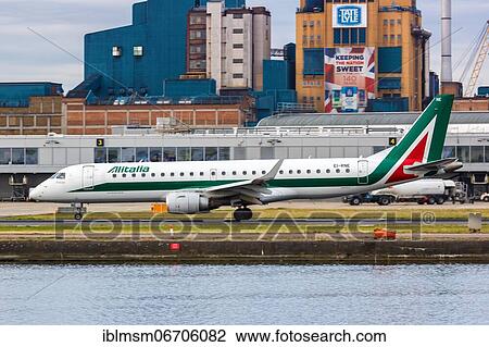 An Embraer 190 of Alitalia CityLiner with the registration EI-RNE at London City Airport (LCY) in London, United Kingdom, Europe View Large Photo Image Stock Image - An Embraer 190 of Alitalia CityLiner with the registration EI-RNE at London City Airport (LCY) in London, United Kingdom, Europe. Fotosearch