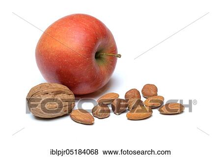 Stock Photo - Apple, hazelnuts, almonds and walnut. Fotosearch