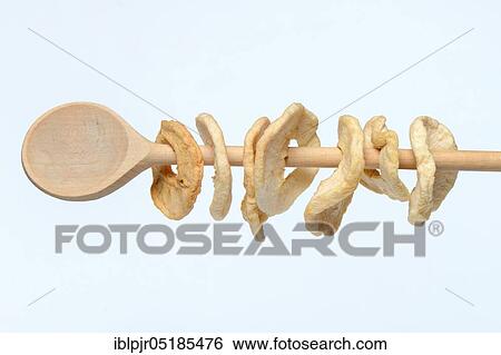 Apple rings on wooden spoon View Large Photo Image Stock Photograph - Apple rings on wooden spoon. Fotosearch