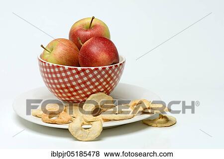 Stock Photo - Apples in bowl and apple rings, Gala variety. Fotosearch