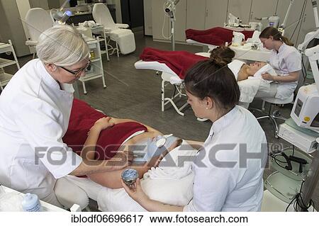 Stock Photo - Application of the blue face pack with azulene in practical lessons. Training as a beautician at the vocational school, Düsseldorf, North Rhine-Westphalia, Germany, Europe. Fotosearch