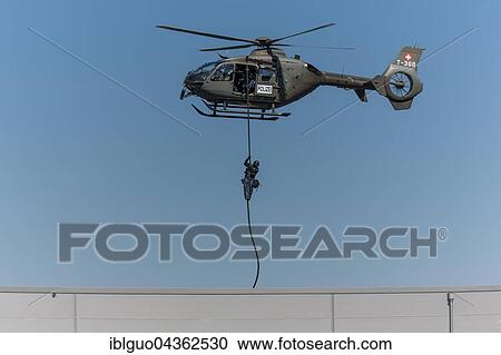 Armed policeman abseiling from helicopter onto roof, body armour, Lucerne police, Luchs special operations group during an exercise, Switzerland, Europe View Large Photo Image Stock Image - Armed policeman abseiling from helicopter onto roof, body armour, Lucerne police, Luchs special operations group during an exercise, Switzerland, Europe. Fotosearch