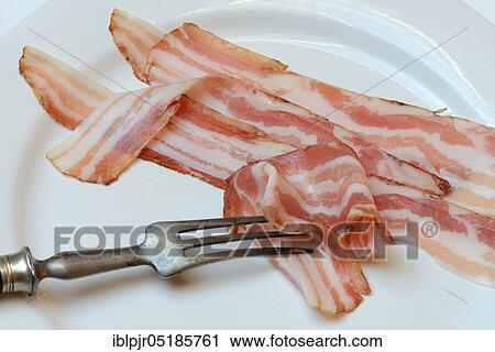 Bacon on plate with fork, bacon strips, breakfast bacon View Large Photo Image Stock Image - Bacon on plate with fork, bacon strips, breakfast bacon. Fotosearch