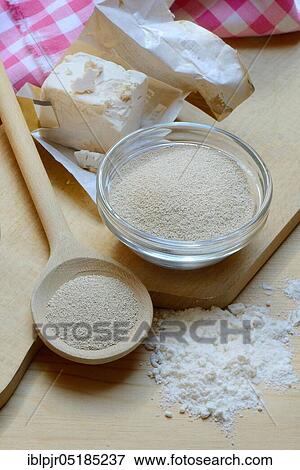 Stock Photo - Baker's yeast, dry yeast in spoon and bowl and fresh yeast, compressed yeast, baking ingredient. Fotosearch