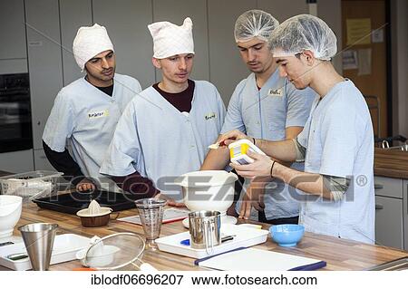 Baking in practical lessons in home economics, integration of refugees in the AVI class (Ausbildungsvorbereitung International) at the Elly-Heuss-Knapp-Schule, a vocational college of the city of Düsseldorf, North Rhine-Westphalia, Germany, Europe View Large Photo Image Stock Photo - Baking in practical lessons in home economics, integration of refugees in the AVI class (Ausbildungsvorbereitung International) at the Elly-Heuss-Knapp-Schule, a vocational college of the city of Düsseldorf, North Rhine-Westphalia, Germany, Europe. Fotosearch