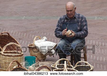 Basket weaver, man on Piazza delle Erbe making baskets, San Gimignano, Province of Siena, Tuscany, Italy, Europe View Large Photo Image Stock Image - Basket weaver, man on Piazza delle Erbe making baskets, San Gimignano, Province of Siena, Tuscany, Italy, Europe. Fotosearch