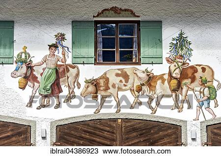 Stock Image - Bavarian Lüftlmalerei, rural scene with cows, old townhall, Bayrischzell, Upper Bavaria, Bavaria, Germany, Europe. Fotosearch