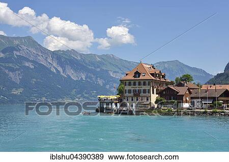 Beach hotel with jetty, Iseltwald, Lake Brienz, Canton of Bern, Switzerland, Europe View Large Photo Image Stock Photo - Beach hotel with jetty, Iseltwald, Lake Brienz, Canton of Bern, Switzerland, Europe. Fotosearch