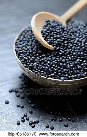 Beluga lentils in cooking spoon View Large Photo Image Stock Image - Beluga lentils in cooking spoon. Fotosearch
