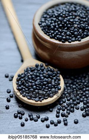 Beluga lentils in cooking spoon View Large Photo Image Stock Photo - Beluga lentils in cooking spoon. Fotosearch
