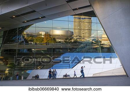 BMW Tower and BMW Museum reflected in the BMW Welt customer experience and exhibition facility building, Munich, Bavaria, Germany, Europe View Large Photo Image Stock Image - BMW Tower and BMW Museum reflected in the BMW Welt customer experience and exhibition facility building, Munich, Bavaria, Germany, Europe. Fotosearch