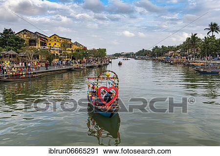 Stock Image - Boat with heart, River front, old town, Hoi An, Vietnam, Asia. Fotosearch