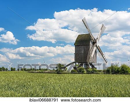 Bockwindmühle in the Magdeburger Börde, mill Lauenroth, in the back modern wind turbines, Wulferstedt, Saxony-Anhalt, Germany, Europe View Large Photo Image Stock Image - Bockwindmühle in the Magdeburger Börde, mill Lauenroth, in the back modern wind turbines, Wulferstedt, Saxony-Anhalt, Germany, Europe. Fotosearch