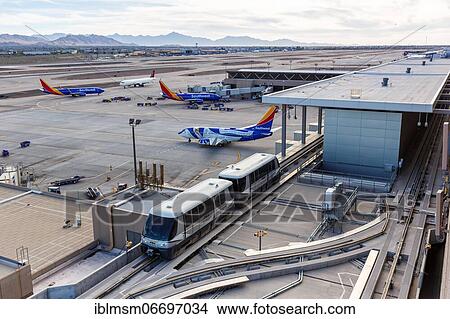 Boeing 737 aircraft of Southwest Airlines and PHX Sky Train at Phoenix Airport, USA, North America View Large Photo Image Picture - Boeing 737 aircraft of Southwest Airlines and PHX Sky Train at Phoenix Airport, USA, North America. Fotosearch