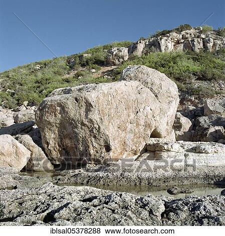 Boulders on the coast of Portinatx, Ibiza, Balearic Islands, Spain, Europe View Large Photo Image Stock Photo - Boulders on the coast of Portinatx, Ibiza, Balearic Islands, Spain, Europe. Fotosearch