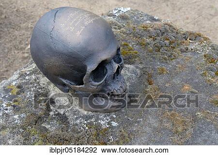 Stock Image - Bronze skull, Johannis cemetery, Nuremberg, Franconia, Bavaria, Germany, Europe. Fotosearch