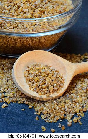 Stock Image - Bulgur, pre-cooked durum wheat, durum wheat semolina, bulgur wheat, wheat groats. Fotosearch