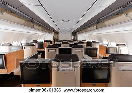 Business class cabin of an Airbus A340-300 aircraft of Swiss at Zurich airport, Switzerland, Europe View Large Photo Image Stock Photograph - Business class cabin of an Airbus A340-300 aircraft of Swiss at Zurich airport, Switzerland, Europe. Fotosearch