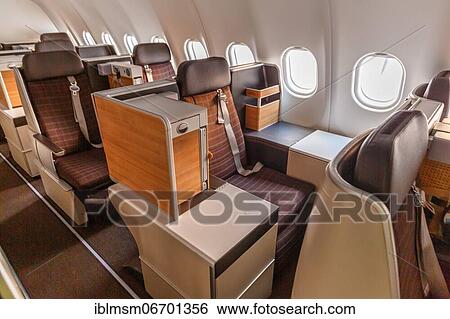 Business Class cabin of an Airbus A340-300 aircraft of Swiss at Zurich Airport (ZRH) in Switzerland View Large Photo Image Stock Photograph - Business Class cabin of an Airbus A340-300 aircraft of Swiss at Zurich Airport (ZRH) in Switzerland. Fotosearch