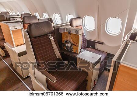 Business Class cabin of an Airbus A340-300 aircraft of Swiss at Zurich Airport (ZRH) in Switzerland View Large Photo Image Stock Photograph - Business Class cabin of an Airbus A340-300 aircraft of Swiss at Zurich Airport (ZRH) in Switzerland. Fotosearch