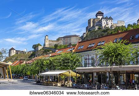 Picture - Cafés on Peace Square with Trencin Castle, Trencin, Slovakia, Europe. Fotosearch