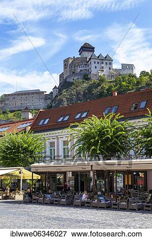 Cafés on Peace Square with Trencin Castle, Trencin, Slovakia, Europe View Large Photo Image Stock Photo - Cafés on Peace Square with Trencin Castle, Trencin, Slovakia, Europe. Fotosearch