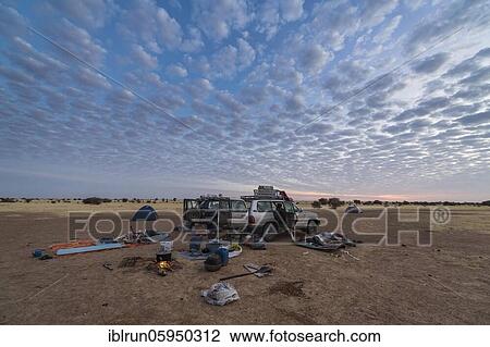 Camping under a dramatic morning sky in the Sahel, Chad, Africa View Large Photo Image Stock Image - Camping under a dramatic morning sky in the Sahel, Chad, Africa. Fotosearch