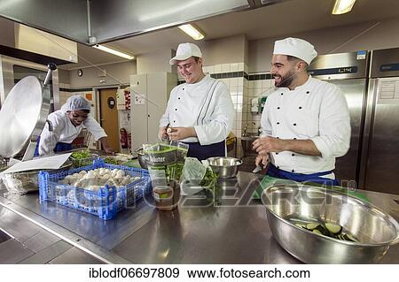 Stock Photo - Canteen kitchen in a vocational college, trainees manage the school's catering as part of their training, practical lessons in the canteen's canteen kitchen, Düsseldorf, Germany, Europe. Fotosearch