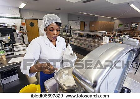 Stock Photo - Canteen kitchen in a vocational college, trainees manage the school's catering as part of their training, practical lessons in the canteen's canteen kitchen, Düsseldorf, Germany, Europe. Fotosearch