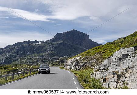 Picture - Car on road through tundra, back of Bitihorn Mountain, Jotunheimen National Park, Norway, Europe. Fotosearch
