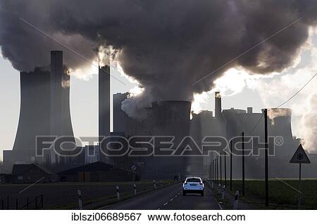 Car on the way to the lignite-fired power plant Niederaussem, Bergheim, Rhenish lignite mining area, North Rhine-Westphalia, Germany, Europe View Large Photo Image Stock Photo - Car on the way to the lignite-fired power plant Niederaussem, Bergheim, Rhenish lignite mining area, North Rhine-Westphalia, Germany, Europe. Fotosearch