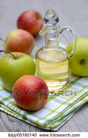 Carafe with apple vinegar and apples View Large Photo Image Stock Image - Carafe with apple vinegar and apples. Fotosearch