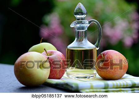 Carafe with apple vinegar and apples View Large Photo Image Stock Photo - Carafe with apple vinegar and apples. Fotosearch